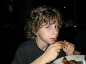 Jacob enjoying peanut and nut safe ribs at Wildfire Restaurant